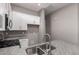 The kitchen area features granite countertops and stainless steel sink at 16785 W Montana De Oro Dr, Surprise, AZ 85387