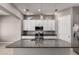 Modern kitchen features granite counters, island, stainless appliances, and a convenient microwave at 16785 W Montana De Oro Dr, Surprise, AZ 85387