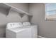Laundry room featuring modern washer and dryer units at 16785 W Montana De Oro Dr, Surprise, AZ 85387