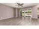 Bright living room with large sliding glass doors leading to the outdoor patio area at 16785 W Montana De Oro Dr, Surprise, AZ 85387