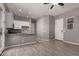 Open concept living room and kitchen with tile floors at 16785 W Montana De Oro Dr, Surprise, AZ 85387