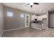 Living room showcasing kitchen with granite countertops at 16785 W Montana De Oro Dr, Surprise, AZ 85387