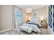 Bright bedroom with neutral colors, ample natural light, and contemporary decor at 16895 W Bronco Trl, Surprise, AZ 85387