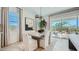 Elegant dining room with modern lighting, seating for six, and access to the outdoor patio at 16895 W Bronco Trl, Surprise, AZ 85387