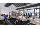 A fitness center with weights, machines, and large windows overlooking the community pool at 16895 W Bronco Trl, Surprise, AZ 85387
