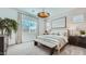 Cozy main bedroom with soft lighting, neutral decor, and a comfortable king-size bed at 16895 W Bronco Trl, Surprise, AZ 85387
