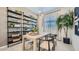 Stylish home office featuring built-in shelves, a large window, and a comfortable workspace at 16895 W Bronco Trl, Surprise, AZ 85387