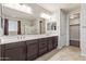 Bathroom with double sink vanity, large mirror, tiled floors, and separate shower and bathtub at 19022 W Shangri La Rd, Surprise, AZ 85388