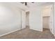 Bedroom featuring neutral walls, carpet, ceiling fan, and a walk-in closet at 19022 W Shangri La Rd, Surprise, AZ 85388