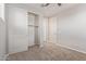 Bedroom featuring neutral carpet, closet with sliding doors, and ceiling fan at 19022 W Shangri La Rd, Surprise, AZ 85388