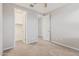 Bedroom featuring neutral walls, carpet, ceiling fan, and a walk-in closet at 19022 W Shangri La Rd, Surprise, AZ 85388