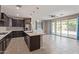 Open kitchen with island, sleek appliances, and modern fixtures at 19022 W Shangri La Rd, Surprise, AZ 85388