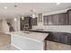Gourmet kitchen featuring stainless steel appliances and quartz countertops at 19022 W Shangri La Rd, Surprise, AZ 85388