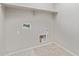 Bright laundry room showcasing hook ups, and ample space for laundry needs at 19022 W Shangri La Rd, Surprise, AZ 85388