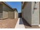 View of the home's side yard with a gated access to the backyard at 19022 W Shangri La Rd, Surprise, AZ 85388