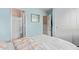 Blue bedroom with an ensuite bathroom at 2031 N 77Th Ln, Phoenix, AZ 85035