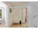 Bright entryway with tile flooring, white door, welcome mat, and access to other rooms at 2031 N 77Th Ln, Phoenix, AZ 85035