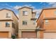 View of the exterior of the home with a garage and neatly kept front yard at 2031 N 77Th Ln, Phoenix, AZ 85035
