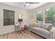 Bright home office featuring stylish decor, natural light, and a ceiling fan at 2031 N 77Th Ln, Phoenix, AZ 85035