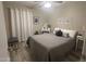 Inviting bedroom with a queen-size bed, wood floors, and a vanity at 2110 E Williams Dr, Phoenix, AZ 85024