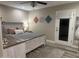 Bedroom featuring a door to outside, plank floors and artwork at 2110 E Williams Dr, Phoenix, AZ 85024