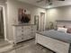Bedroom featuring a queen-sized bed, a dresser and wood-look flooring at 2110 E Williams Dr, Phoenix, AZ 85024