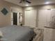 Bedroom featuring a door to outside, plank floors and closet at 2110 E Williams Dr, Phoenix, AZ 85024
