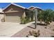 Charming home showcasing desert landscaping and a two-car garage at 2110 E Williams Dr, Phoenix, AZ 85024