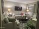 Cozy living room featuring plush seating, stylish decor, and ample natural light at 2110 E Williams Dr, Phoenix, AZ 85024