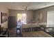 Bright living room with neutral décor, sliding glass doors to the backyard, and comfortable seating arrangement at 2110 E Williams Dr, Phoenix, AZ 85024