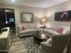 Cozy living room featuring plush seating, stylish decor, and ample natural light at 2110 E Williams Dr, Phoenix, AZ 85024