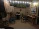 Charming outdoor patio featuring string lights, BBQ grill, and a cozy seating area with potted plants at 2110 E Williams Dr, Phoenix, AZ 85024
