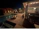 Beautiful backyard featuring a sparkling pool, brick patio, cozy seating, and outdoor bar for entertaining at 2110 E Williams Dr, Phoenix, AZ 85024