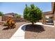 Backyard featuring desert landscaping, a sidewalk, and a swing set at 2177 W Agrarian Hills Dr, San Tan Valley, AZ 85144