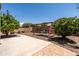 View of the backyard, featuring lush plants, a swing set and patio at 2177 W Agrarian Hills Dr, San Tan Valley, AZ 85144