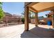 Covered patio overlooking a spacious backyard with a swing set and storage at 2177 W Agrarian Hills Dr, San Tan Valley, AZ 85144