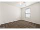 Bedroom with neutral carpeting, ceiling fan, and natural light from a window with blinds at 2177 W Agrarian Hills Dr, San Tan Valley, AZ 85144