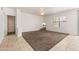 This bedroom has a ceiling fan, window and neutral walls with comfortable carpet at 2177 W Agrarian Hills Dr, San Tan Valley, AZ 85144