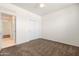 Bedroom with neutral carpeting, ceiling fan, and closet with convenient access to the hallway at 2177 W Agrarian Hills Dr, San Tan Valley, AZ 85144
