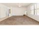 A bedroom with a ceiling fan, a window, and neutral-colored walls and carpeting at 2177 W Agrarian Hills Dr, San Tan Valley, AZ 85144