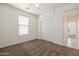 Bedroom showcasing plush carpeting, ceiling fan, and ample closet space with convenient access to the hallway at 2177 W Agrarian Hills Dr, San Tan Valley, AZ 85144
