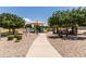 Inviting community park with walking paths, playground, shaded picnic areas, and grassy areas at 2177 W Agrarian Hills Dr, San Tan Valley, AZ 85144