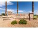 Inviting Skyline Ranch community sign featuring beautiful stonework and lush desert landscaping at 2177 W Agrarian Hills Dr, San Tan Valley, AZ 85144