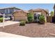 Inviting single-story home with a well-kept front yard and a two-car garage, perfect for suburban living at 2177 W Agrarian Hills Dr, San Tan Valley, AZ 85144