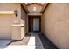 Inviting entryway with a stylish front door, decorative lighting, and desert landscaping at 2177 W Agrarian Hills Dr, San Tan Valley, AZ 85144
