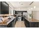 A well-lit kitchen featuring stainless appliances, granite countertops, and tile backsplash at 2177 W Agrarian Hills Dr, San Tan Valley, AZ 85144