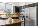 The kitchen features stainless steel appliances, dark cabinets, and a granite countertop island at 2177 W Agrarian Hills Dr, San Tan Valley, AZ 85144