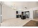 Bright, open kitchen with dark cabinetry, stainless steel appliances, and a central island, great for entertaining at 2177 W Agrarian Hills Dr, San Tan Valley, AZ 85144