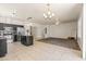 Bright open-plan living room and kitchen area with tile flooring, and a ceiling fan at 2177 W Agrarian Hills Dr, San Tan Valley, AZ 85144