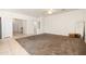 A bedroom with neutral colored walls and carpeting, with entrances to hall and bathroom at 2177 W Agrarian Hills Dr, San Tan Valley, AZ 85144